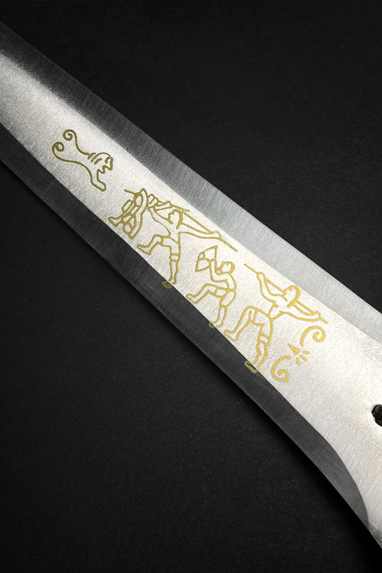 Fantasy Edge medieval dagger blade closeup with gold etching and ornate hilt detail Roman dagger with blue crystal