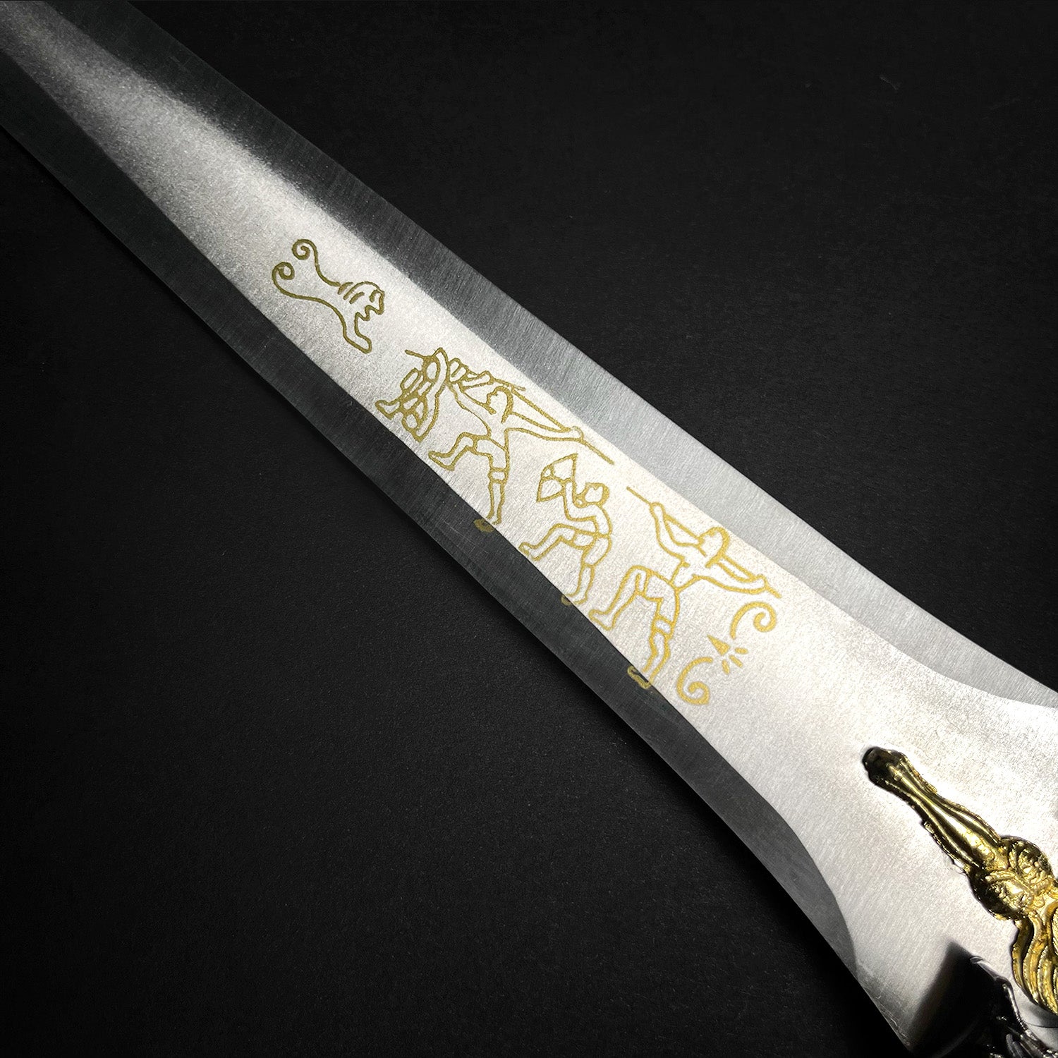 Fantasy Edge medieval dagger blade closeup with gold etching and ornate hilt detail Roman dagger with blue crystal
