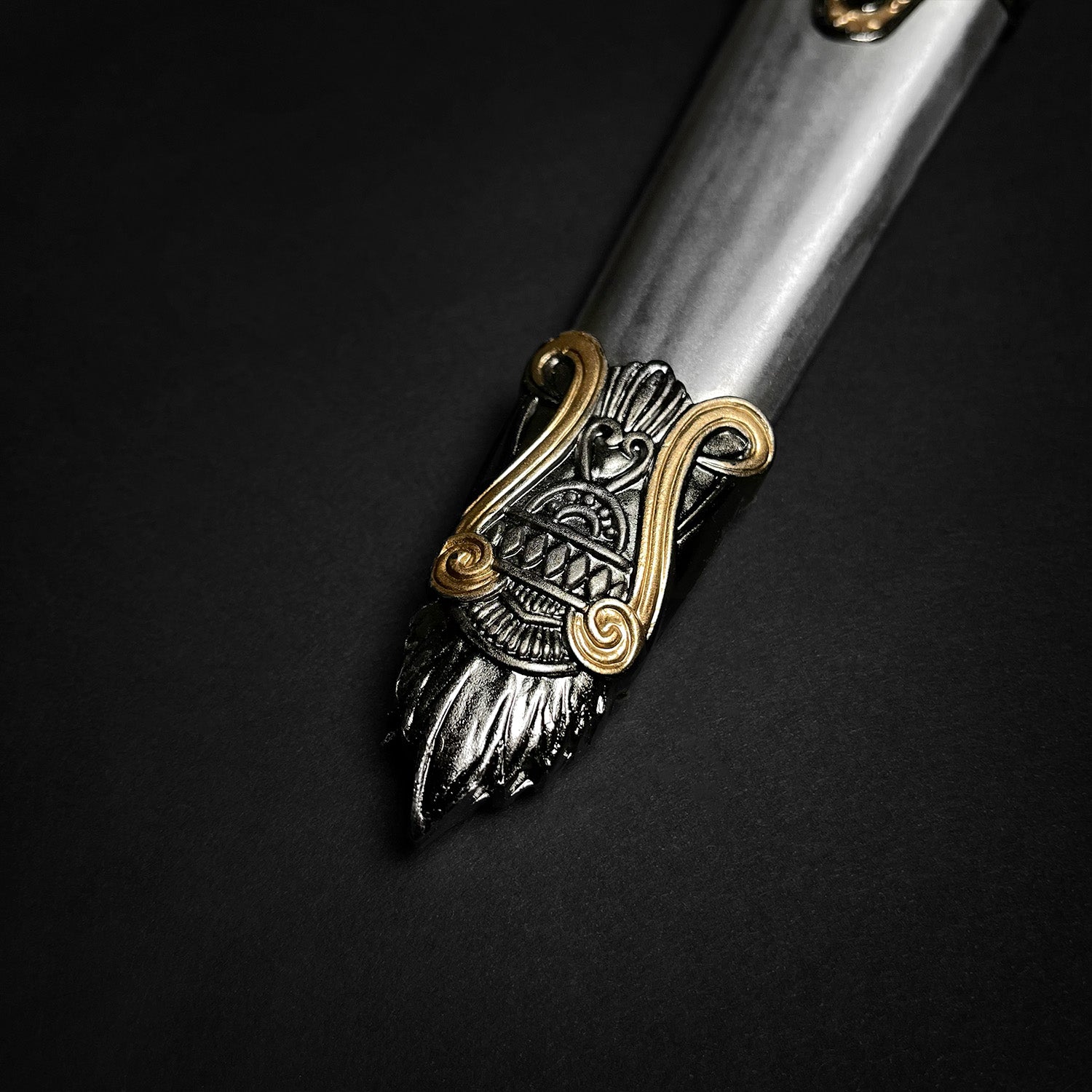 Fantasy Edge Roman dagger with blue crystal ornate silver blade and gold filigree handle close up