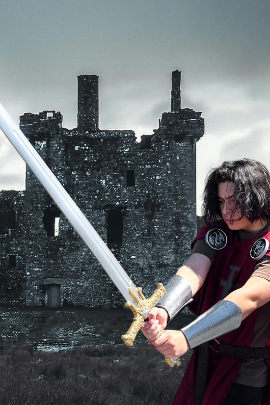 Guild Arms King Solomon Star Red Foam Medieval Sword held by a warrior in front of a castle ruin