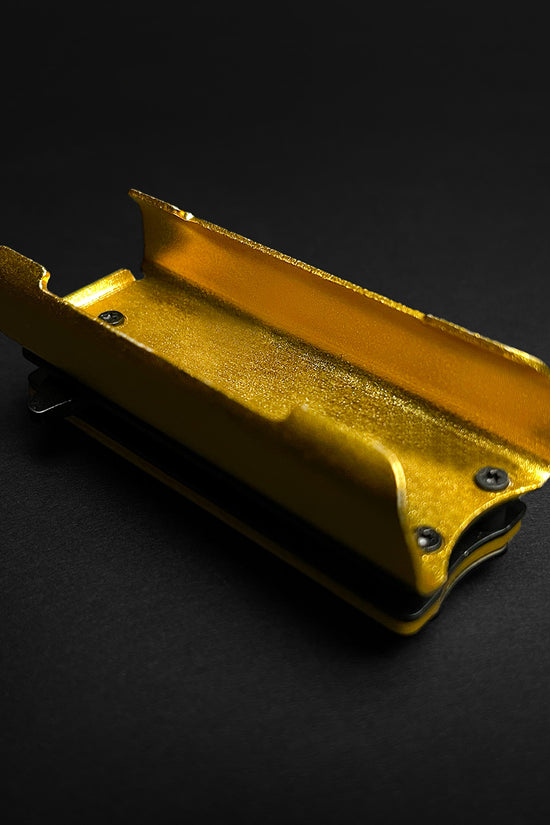 Guild Arms gold knife lighter case 4.5 inch with metal construction on black background