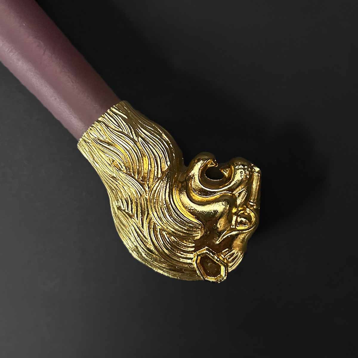 Close-up of the Knight's Collection 'Chimera' Medieval Sword pommel with a detailed lion head design