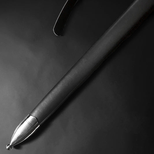 Close-up of Knight's Collection Hand-Forged Medieval Sword with polished grip and detailed hilt design