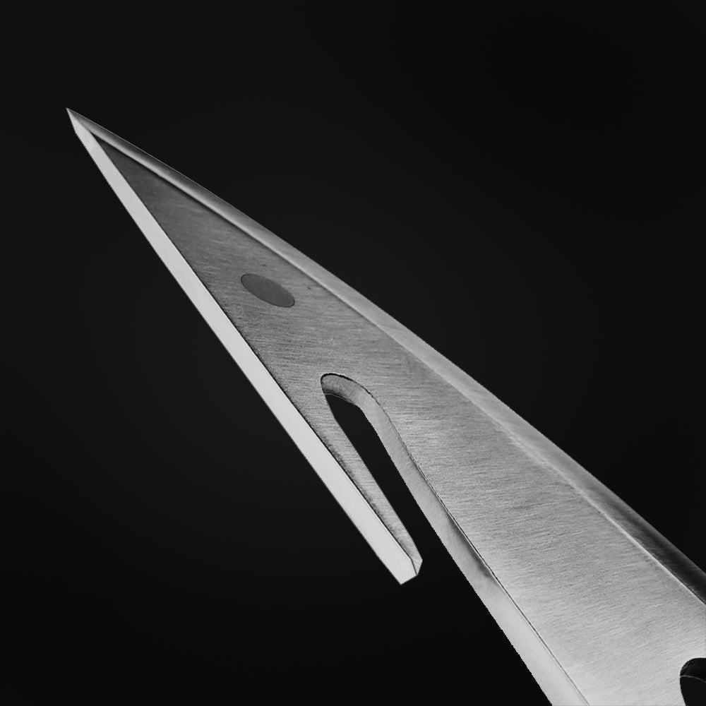 Close-up of a large hunting knife blade by Guild Arms with a sharp tip and sleek design