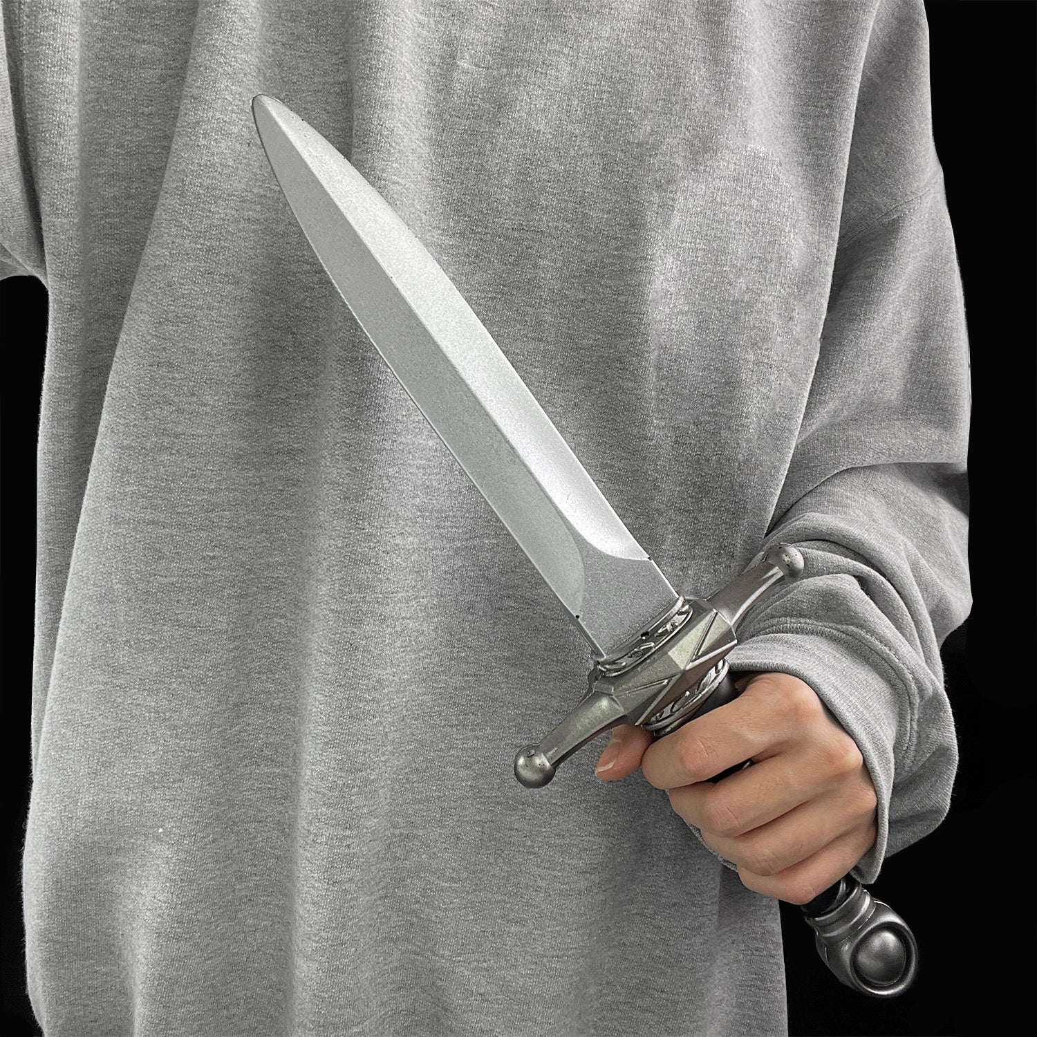 Medieval foam dagger by Guild Arms held in hand, featuring a realistic blade design for safe play