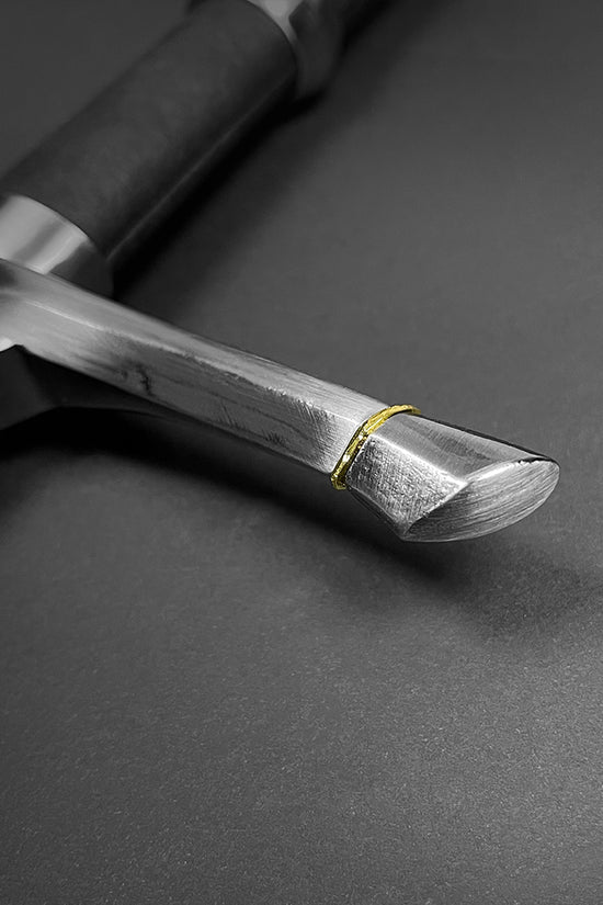 Close-up of Guild Arms medieval knight one hand sword for sale with polished steel blade and textured grip