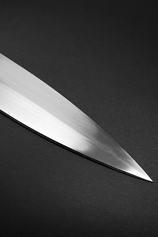 Close-up of a polished blade showcasing the edge of a medieval sword for sale by Guild Arms