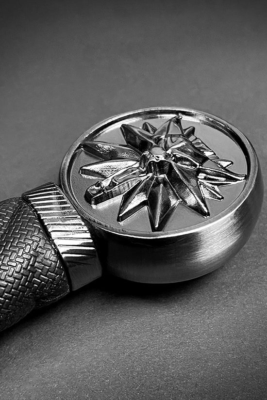 Decorative handle detail of a Guild Arms medieval sword for sale with intricate star design