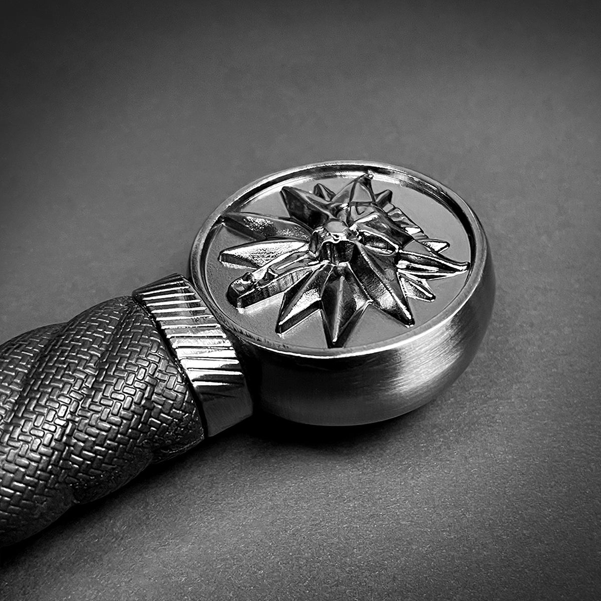 Decorative handle detail of a Guild Arms medieval sword for sale with intricate star design