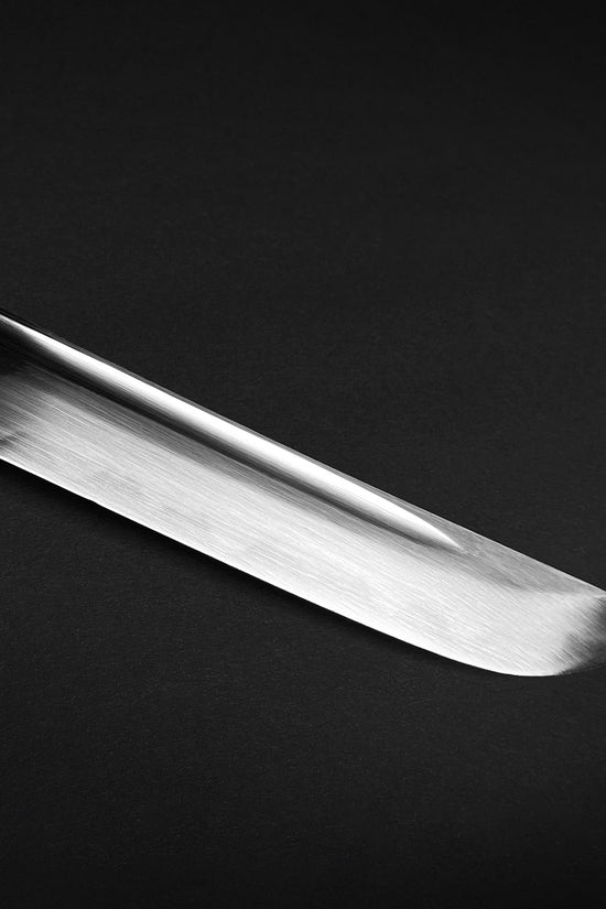 Close-up of Musashi Modern Tactical Wakizashi blade showcasing its sleek finish and sharp edge