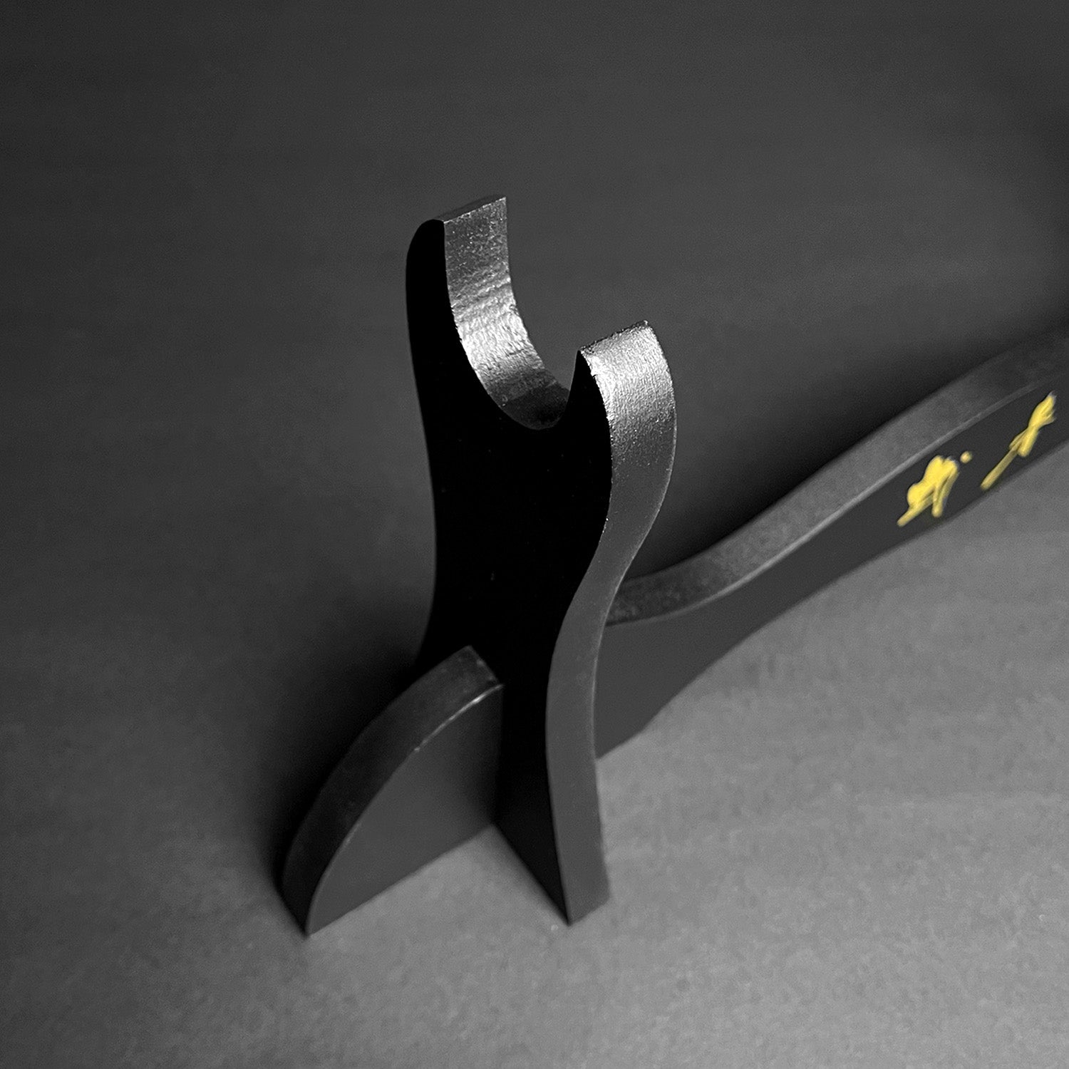 Musha Single Sword Display Stand showcasing a sleek black design for elegant sword presentation