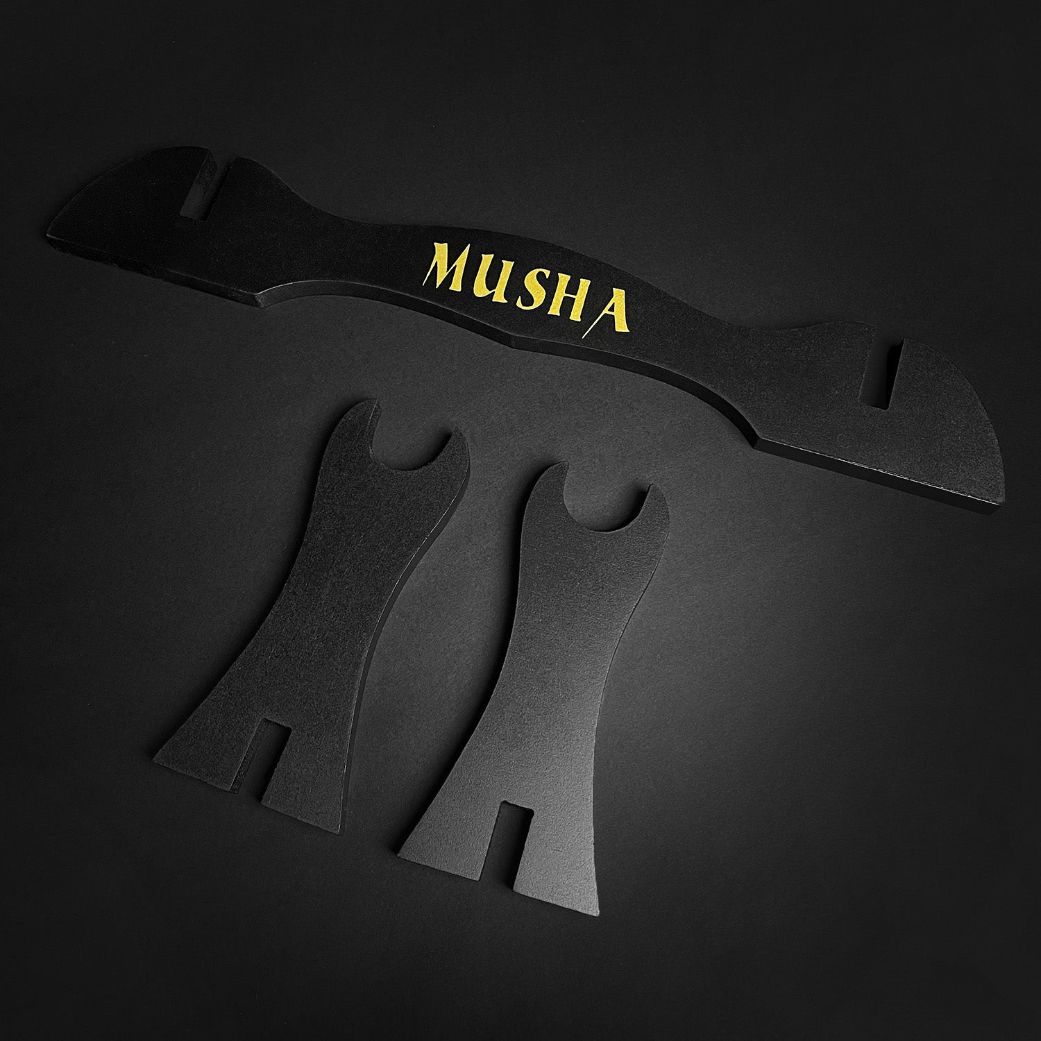 Musha Single Sword Display Stand featuring a sleek black design with gold lettering for elegant sword showcasing