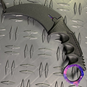 Falcon purple karambit trainer knife with curved black blade and galaxy-patterned handle ring