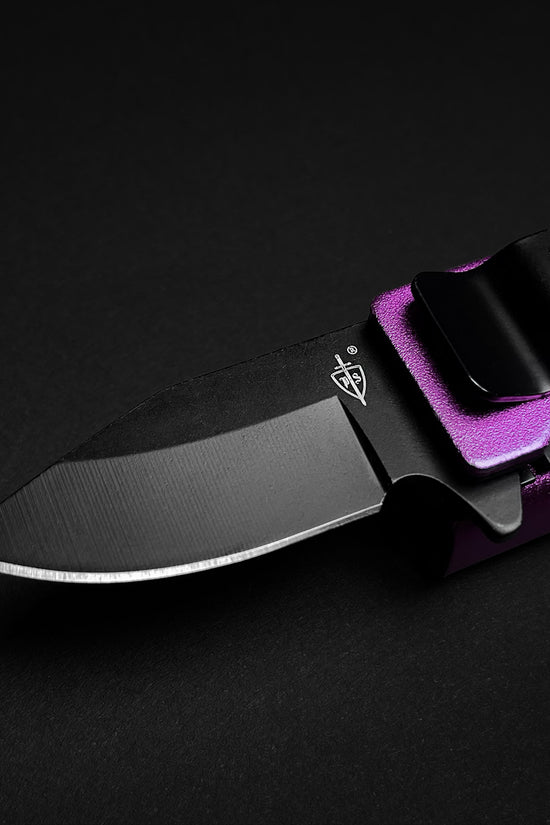 Guild Arms lighter knife with black blade and purple handle featuring knife lighter holder case