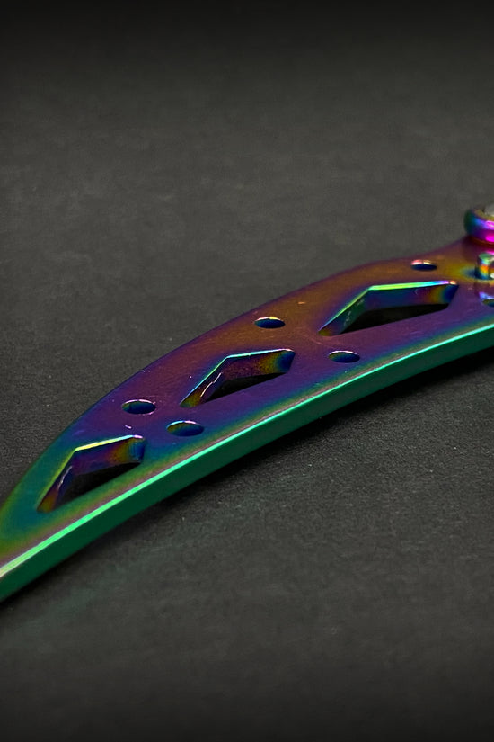Close-up of Guild Arms rainbow butterfly trainer knife showing detailed colorful blade handle
