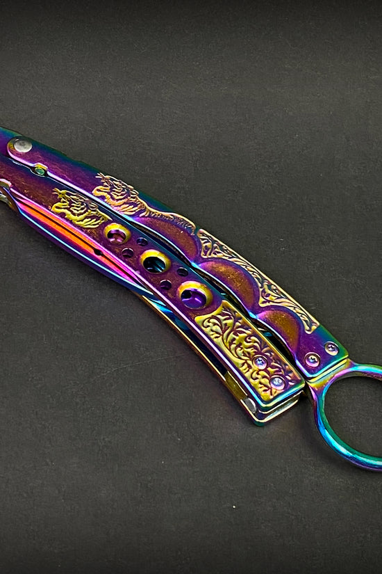 Guild Arms rainbow butterfly trainer knife with intricate engraved handle and colorful metallic finish
