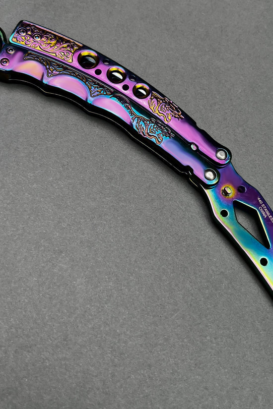 Guild Arms rainbow butterfly trainer knife with vibrant multicolor metallic finish and intricate design details
