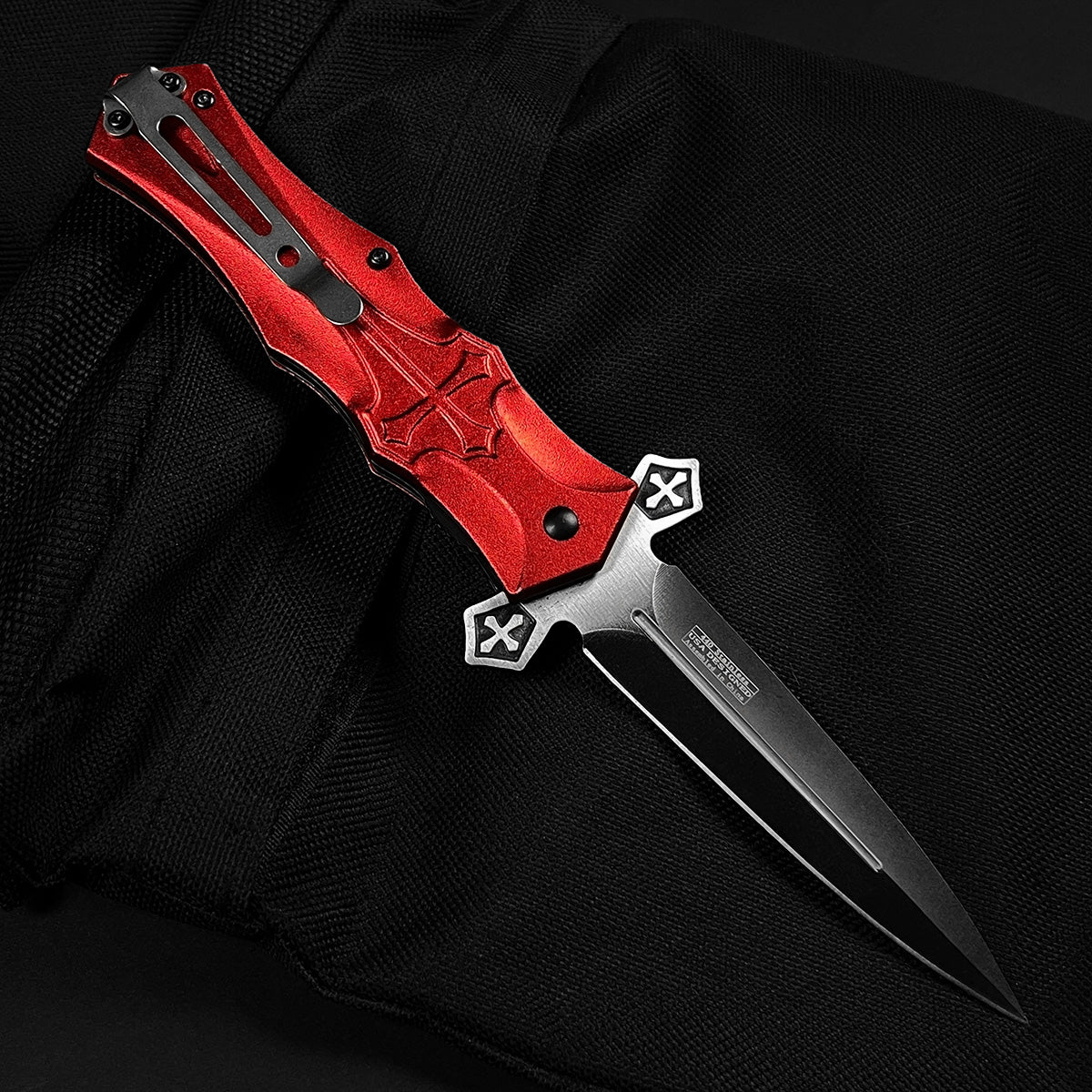 Guild Arms red cross handle spring pocket knife with a sleek black blade and ergonomic design