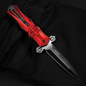 Guild Arms red cross handle spring pocket knife with a sleek black blade and ergonomic design