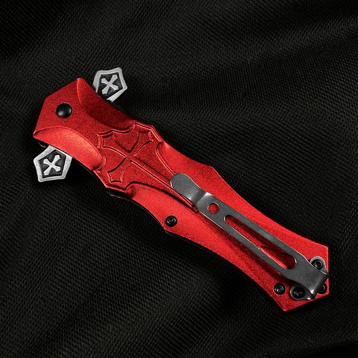 Red cross handle spring pocket knife by Guild Arms featuring a sleek design and sturdy clip