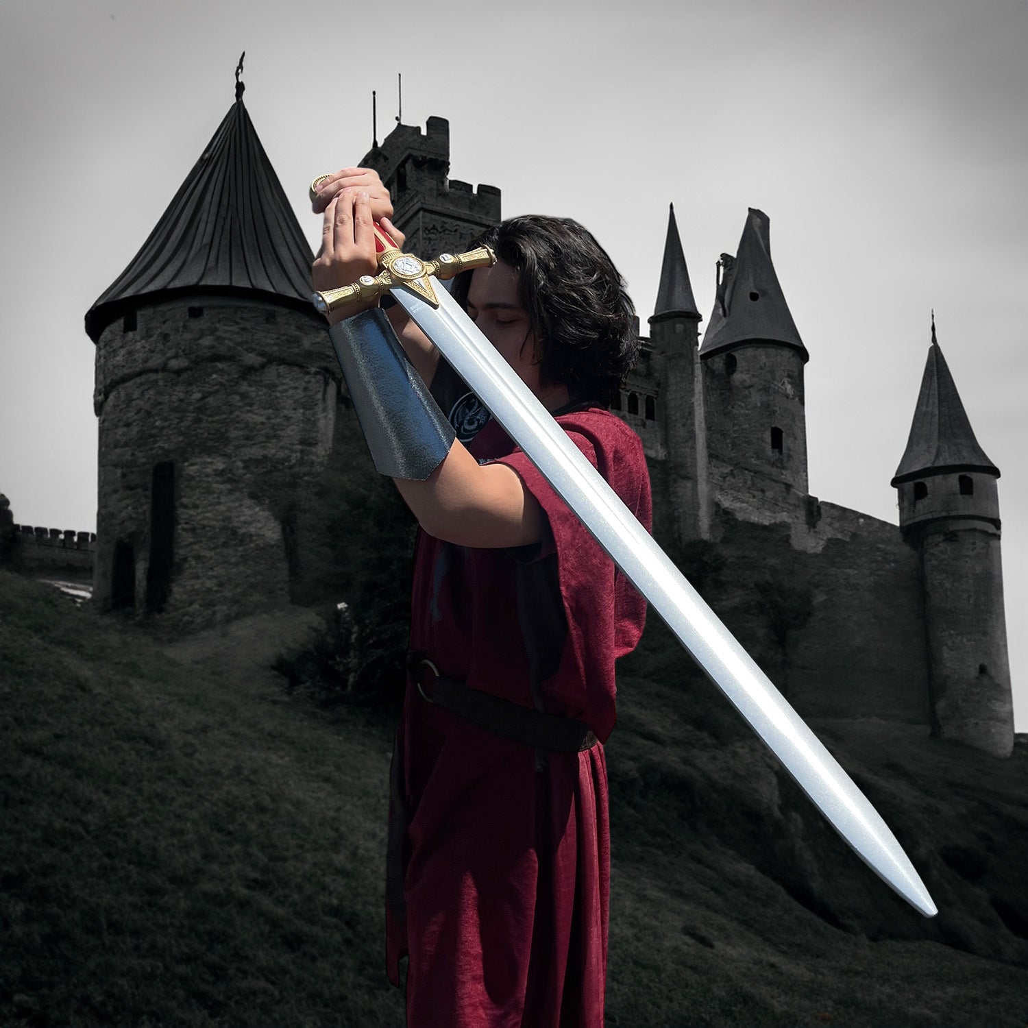 Guild Arms red freemason Foam sword held high in front of a medieval castle backdrop
