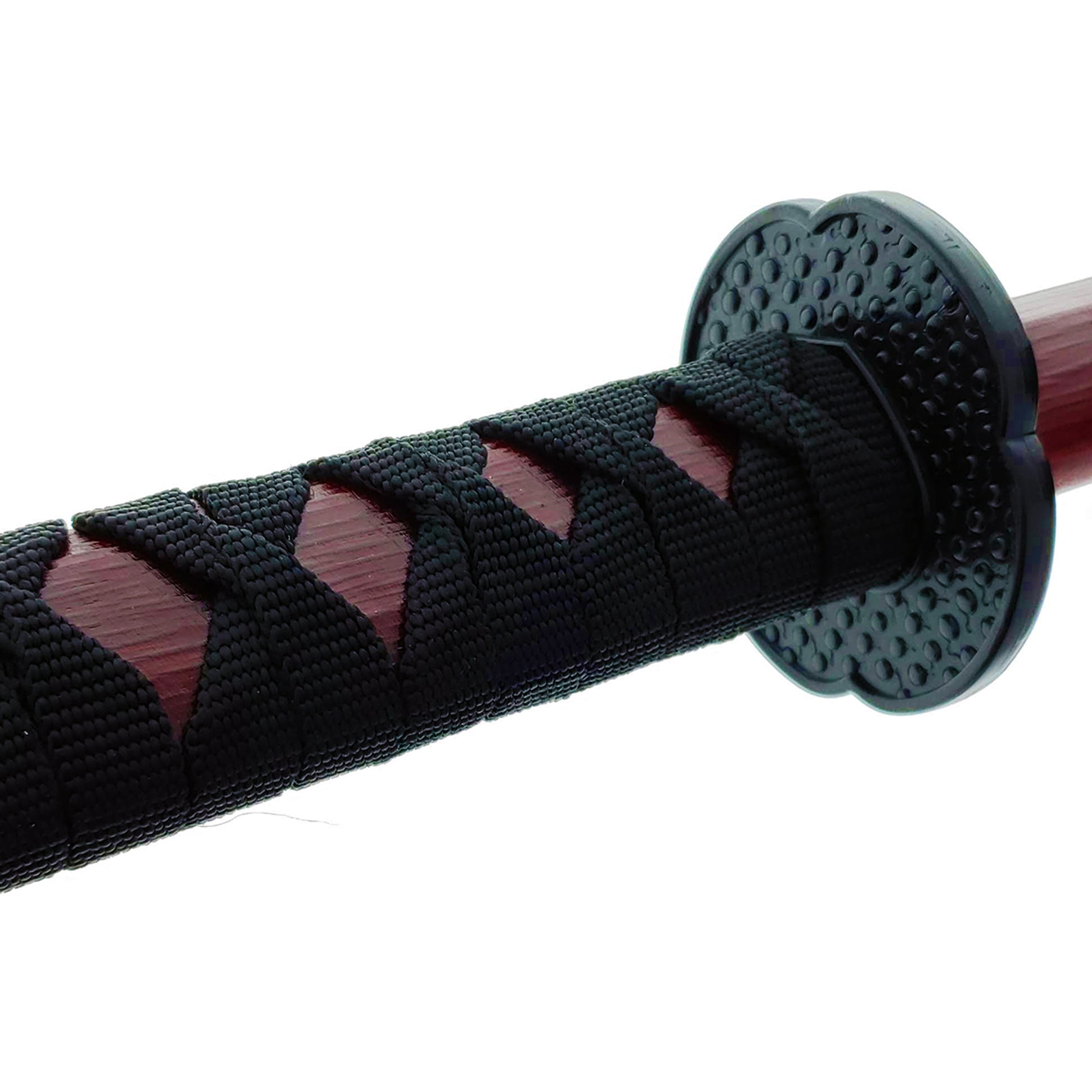 Close-up of a red wooden bokken samurai sword handle with intricate black wrap for enhanced grip