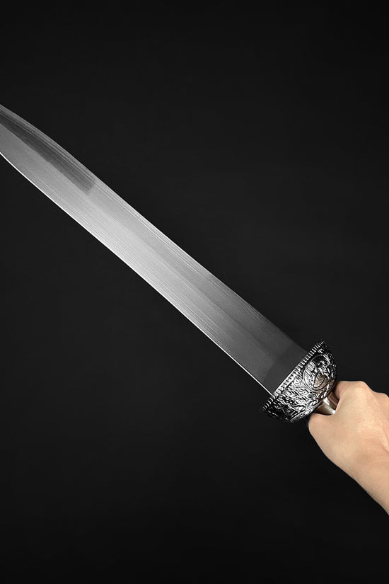 Hand holding a high quality Roman Gladiator sword with intricate details and a polished blade