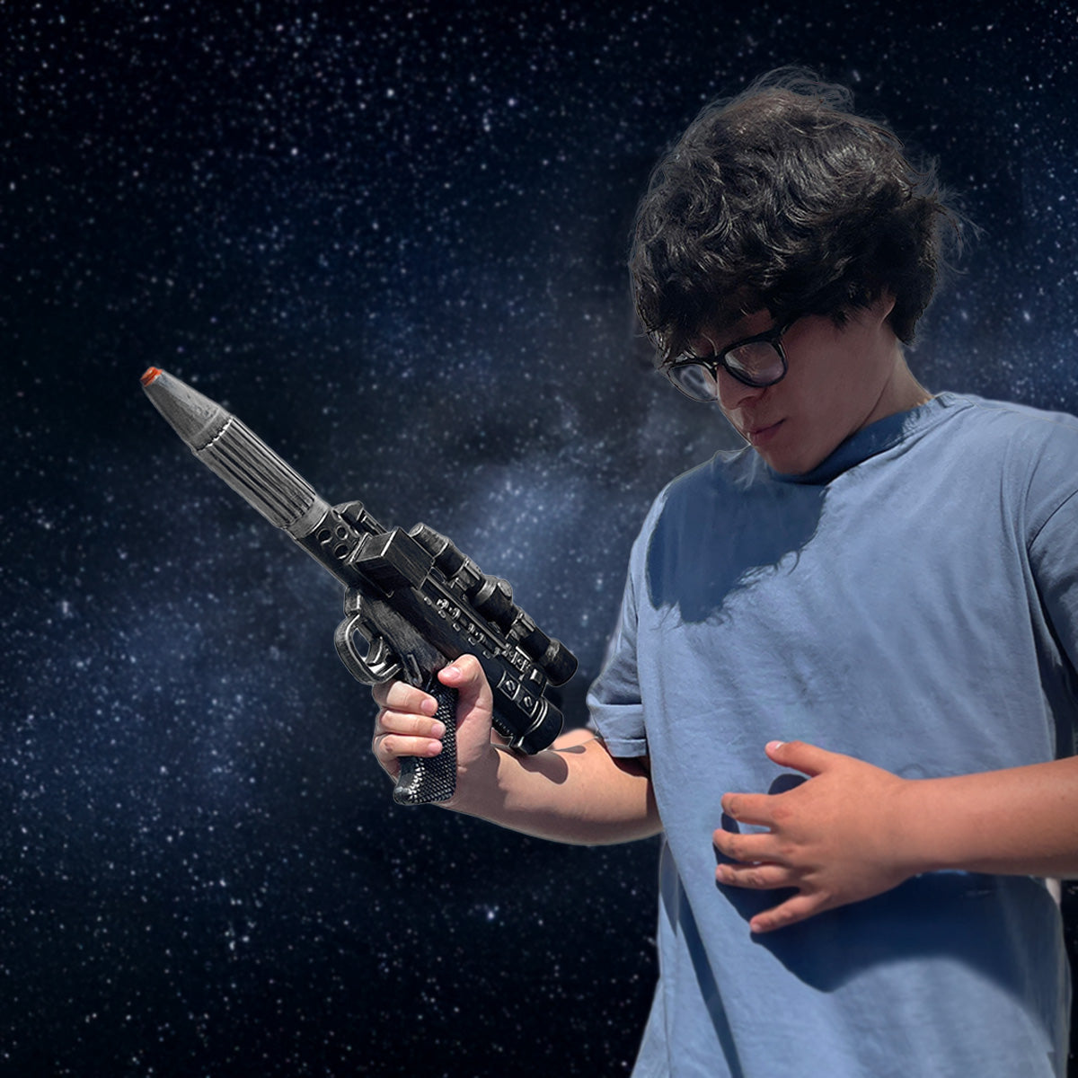 Guild Arms Sci-Fi Cosplay Foam Laser Gun featured with a person in a blue shirt against a cosmic background