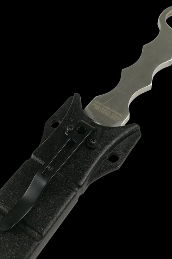 Falcon silver fixed blade tactical knife with ergonomic handle partially sheathed in black case