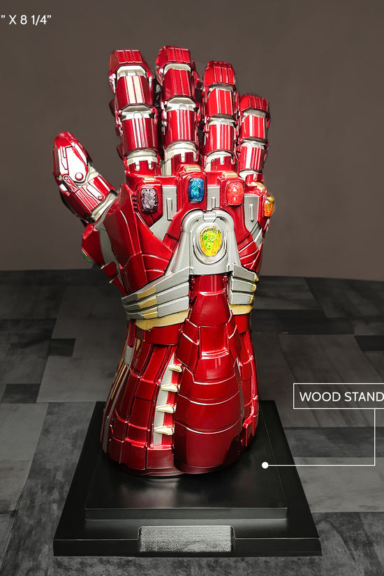 Guild Arms superhero Fantasy costume gloves on display with stand, featuring vibrant red design and gem details