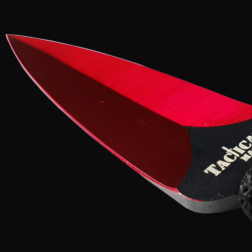 Tactical Master Red Machete With Throwing Knives showcasing a sharp, red-bladed edge for precision cutting