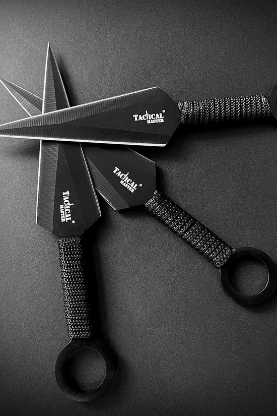 Tactical Master tactical machete with throwing knives set featuring black blades and wrapped handles