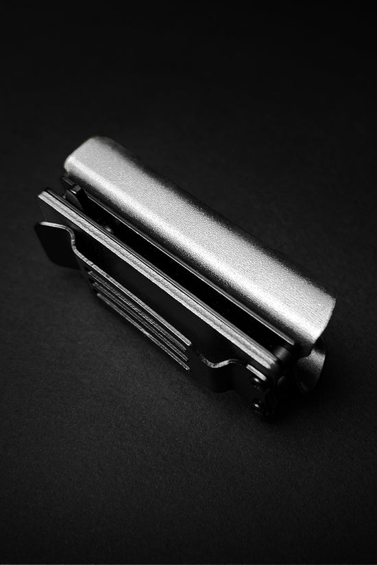 Guild Arms Lighter Case EDC spring assist knife closed silver stainless clip on black background