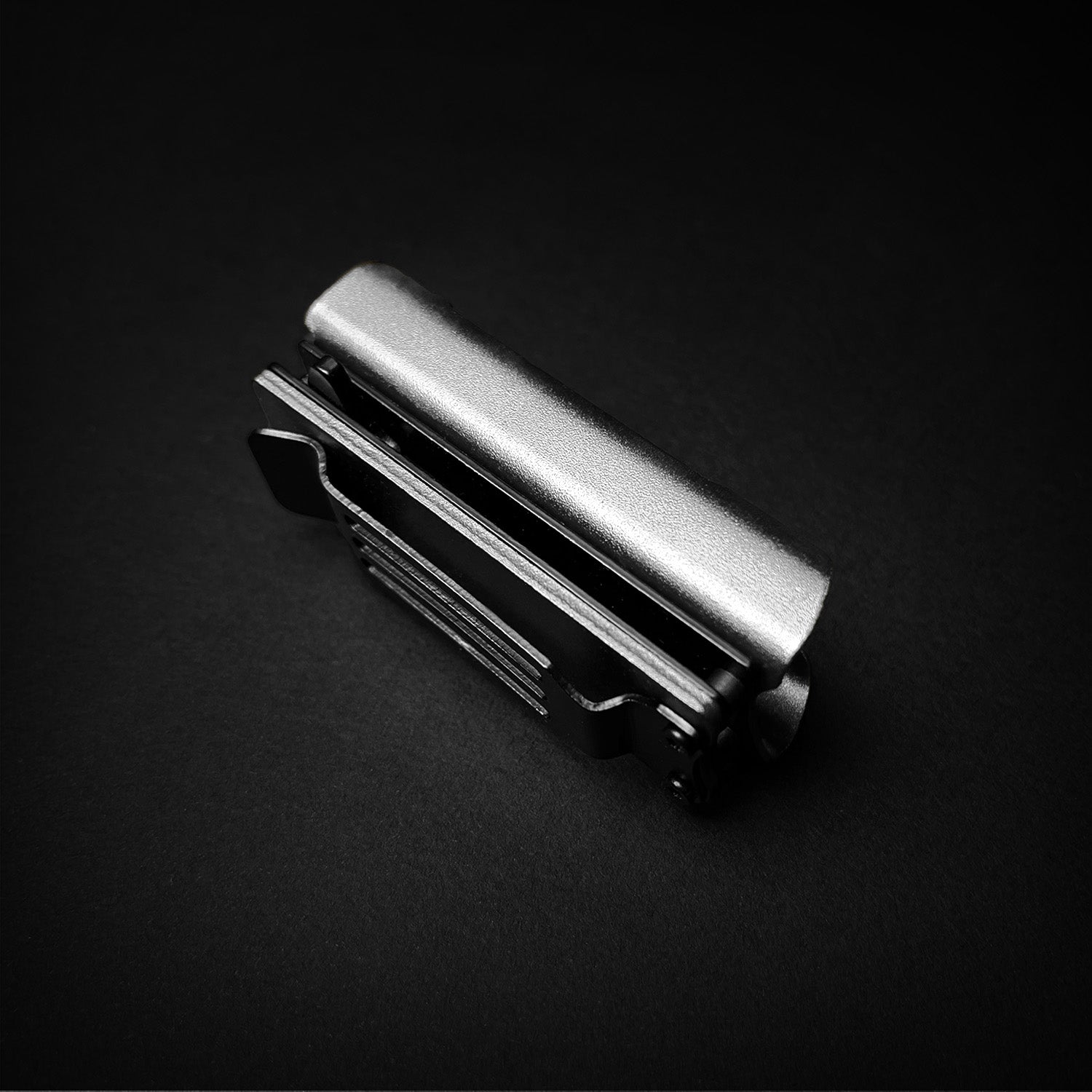 Guild Arms Lighter Case EDC spring assist knife closed silver stainless clip on black background