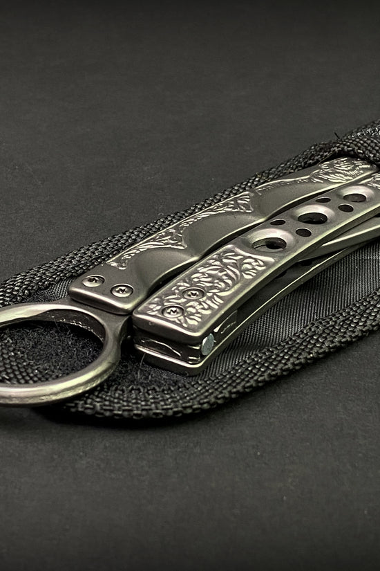 Guild Arms butterfly knife trainer for beginners with detailed handle design in black pouch