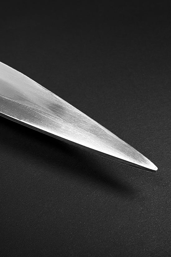 Close-up of sharp blade tip on Guild Arms collectible medieval sword replica with polished steel finish