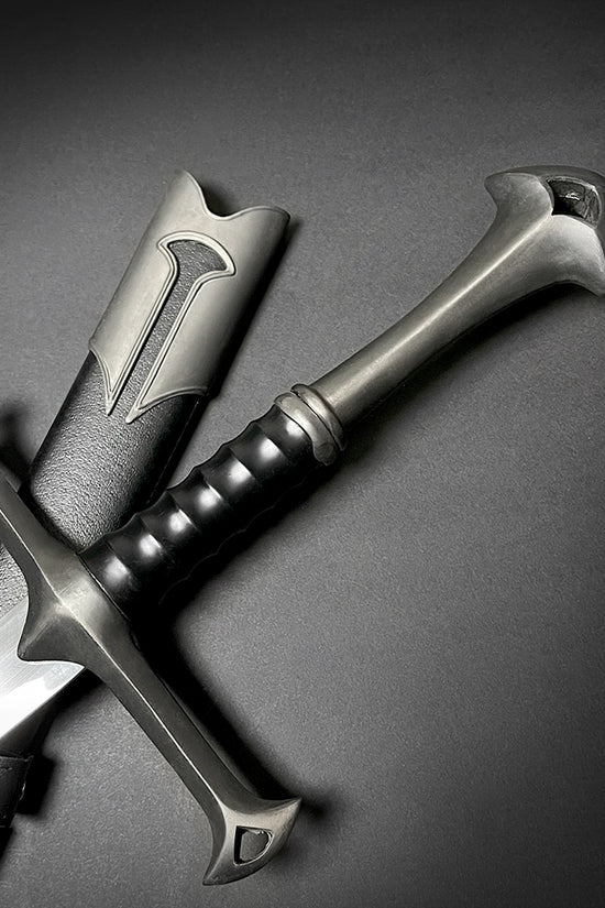 Guild Arms collectible medieval sword replica with detailed hilt and leather sheath on black background