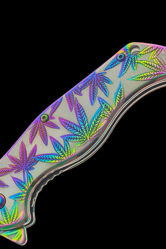 Falcon spring assisted rainbow marijuana pocket knife with vibrant leaf design on handle