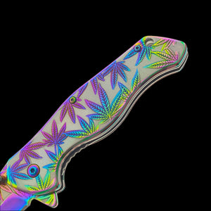 Falcon spring assisted rainbow marijuana pocket knife with vibrant leaf design on handle