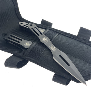 Falcon spider skull throwing knives set with black blades and skull designs in black nylon sheath
