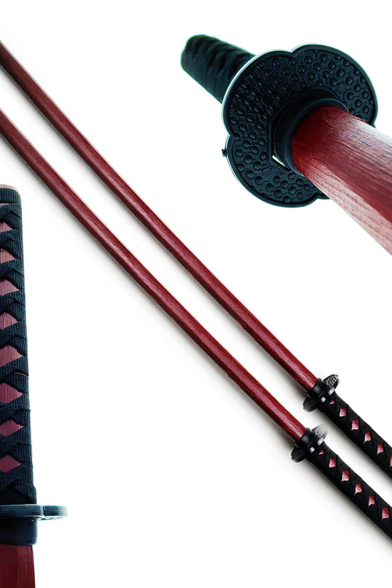 Red wooden bokken samurai sword by Guild Arms with a textured handle and two-piece design